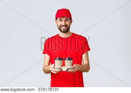 Food Delivery, Quarantine, Stay Home And Order Online Concept. Smiling Courier In Red Cap And T-shir