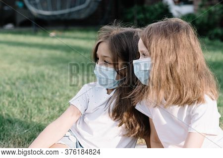 Children In Medical Mask Walk On The Street.
