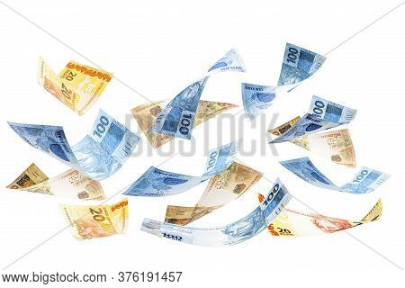 Twenty, Fifty And One Hundred Reais Bills Falling, Money From Brazil On Isolated White Background. M