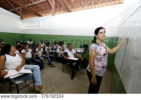 Pojuca, Bahia / Brazil - August 1, 2019: Teacher Is Seen Together With Students In A Public School R