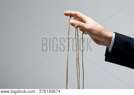 Cropped View Of Puppeteer With Strings On Fingers Isolated On Grey