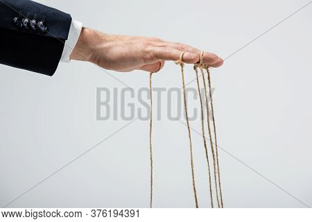 Partial View Of Puppeteer With Strings On Fingers Isolated On Grey