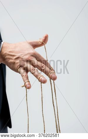 Partial View Of Puppeteer With Strings On Fingers Isolated On Grey