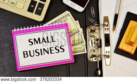Small Business Is The Inscription Of Text On The Notepad Planning Purposes. Strategy To Achieve Comp