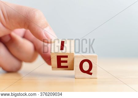 Hand Flip Wooden Cube With Word Iq To Eq. Emotional Intelligence And Intelligence Quotient