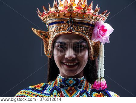 The Beautiful Woman Wearing Thai Southern Folk Dancing Costume,made From Colorful Bead,put Headdress