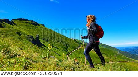 hiking trail,  woman with backpack- Plomb du Cantal, Auvergne-Cantal
