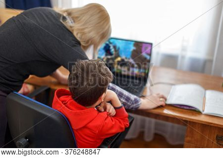 Mother Turning Off Computer For Computer Addicted Little Gamer Kid, Internet And Game Dependency