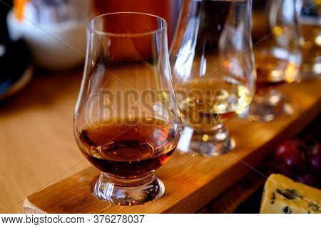Flight Of Scottish Whisky, Tasting Glasses With Variety Of Single Malts Or Blended Whiskey Spirits O