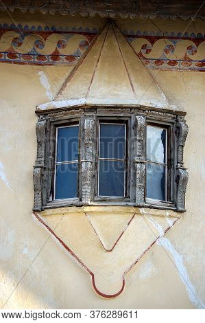 Small Balcony With Wooden Windows In The Ancient Village Of Guarda, Scuol Municipality, Engadin Vall