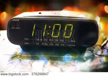 Black Digital Alarm Radio Clock. Alarm Radio Clock Indicating Time To Wake Up. Digital Clock Display
