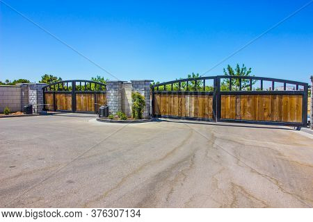 Two Automatic Entrance & Exit Wood & Metal Gates