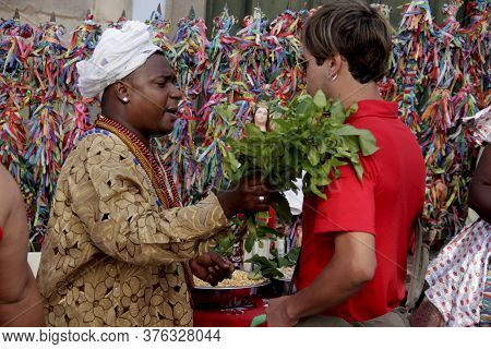 Salvador, Bahia / Brazil - October 7, 2012: Candomble Priest Is Seen Giving Leaves In Person In The 
