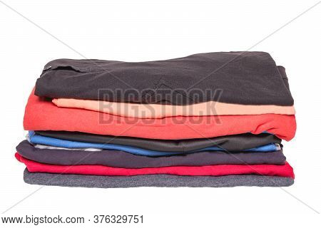 Stack Colorful Clothes. Pile Of Folded Cotton T-shirts Or Shirts Isoliert On A White Background. Sum