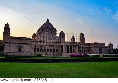 Majestic View Of The Umaid Bhawan Palace And Hotel Against A Setting Sun In Jodhpur, Rajasthan, Indi