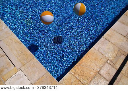 Two Rubber Air Yellow White Inflatable Balls And Toy For Swimming Pool In Transparent Blue Water. Mu
