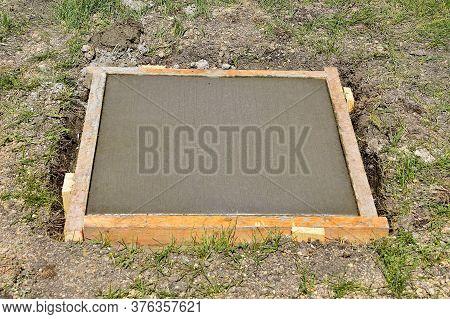 Forms Set In A Square For Freshly Poured Concrete To Serve As A Foundation And Base For A Future Fou