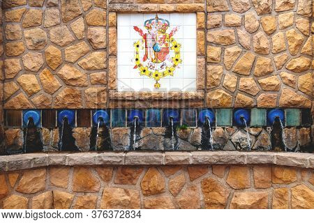 Polop De Marina, Costa Blanca, Spain - 3 Otober 2019: Water Fountains With A Flag Emblem Of Alicante