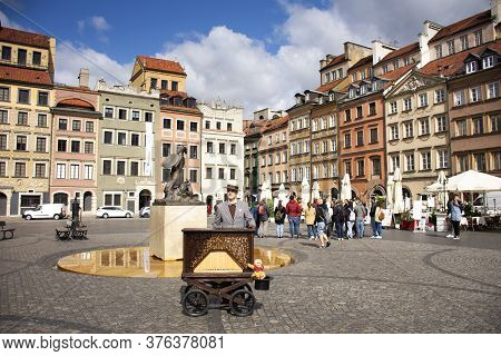 Polish People Wearing Retro Clothes Playing Antique Instrument Music Box Mobile For Show Travelers A