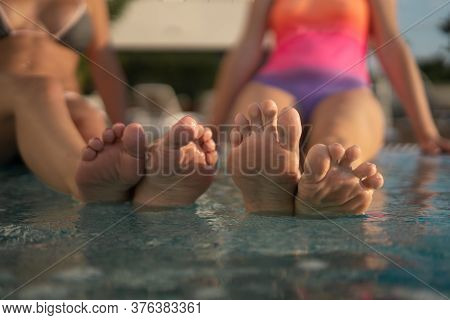 Two Girls Indulge In Noses In A Swimming Pool On Vacation