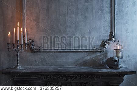 Mystical Halloween Still-life Background. Skull, Candlestick With Candles, Old Fireplace. Horror And