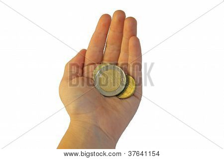 Hand Of A Young Girl Who Is Holding Two Euro