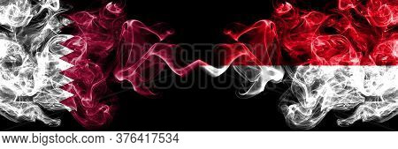 Qatar Vs Monaco, Monacan Smoky Mystic Flags Placed Side By Side. Thick Colored Silky Abstract Smoke 