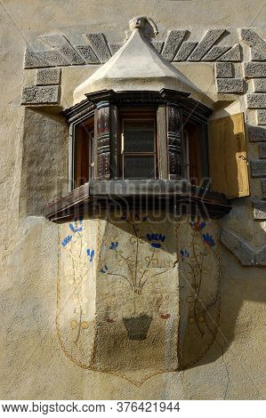 Ardez, Switzerland - Aug 14, 2009: Old Balcony With Wooden Windows In The Ancient Village Of Ardez, 