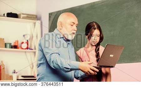 Pedagogue Of Digital Science. Little Girl With Man Tutor Study Hold Laptop. Online Lesson. Pedagogue