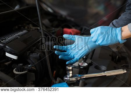 Car Care, Check The Engine Before Departure, Mechanic Wearing Gloves.