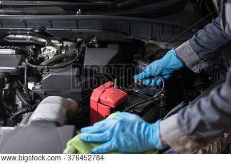 Maintenance Of The Engine To Work Efficiently, Technician Is Checking Battery, Close-up.