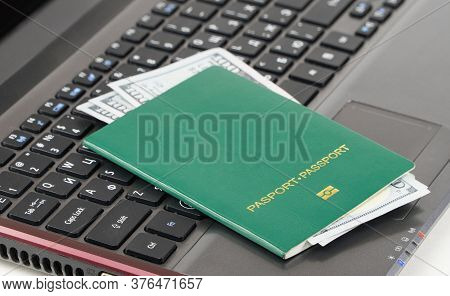Green Passport On The Keyboard