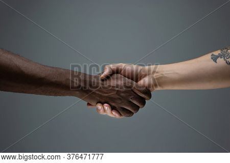 Togetherness. Racial Tolerance. Respect Social Unity. African And Caucasian Hands Gesturing On Gray 