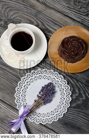 A Cup Of Black Coffee On A Saucer And Zephyr In Chocolate Made In The Form Of A Rose. Nearby On A Wh