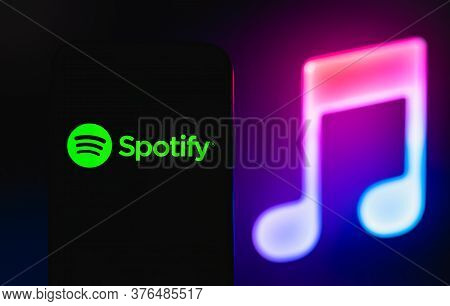 Spotify Logo On The Smartphone Screen. Black Background. High Quality Photo