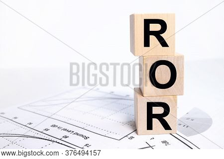 Wooden Blocks With The Word Ror . High Level Of Business Profitability. Return On Investment, Invest