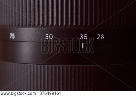 View Of The Focal Length Ring Photo Lens 28-75 Mm. Close-up. Very High Quality Photo.