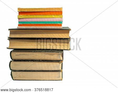 A Stack Of Books Of Different Format And Thickness Isolated On A White Background. Clean Place For T
