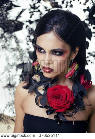 Pretty Brunette Woman With Rose Jewelry, Black And Red, Bright Make Up Kike A Vampire Closeup Red Li