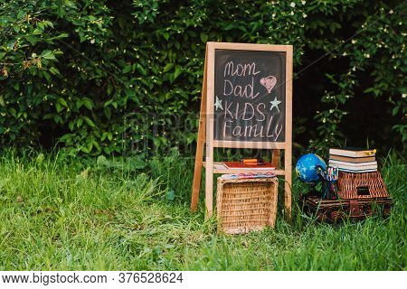 Back To School - School Equipment And Books On The Basket. Soft Focus. Place For Text