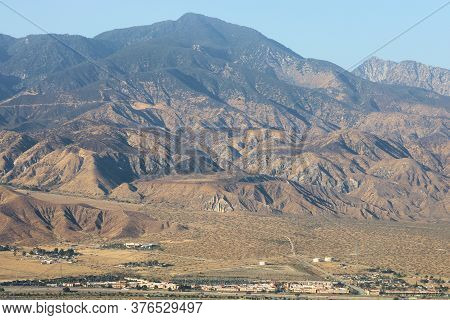 View Of The Town Of Cabazon, Ca Sadwiched Between Two Mountain Ranges Talen From The San Jacinto Mou