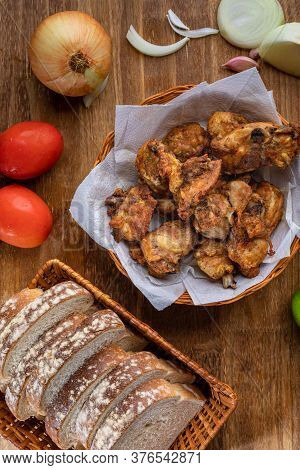 Brazilian Style Deep Fried Chicken And Sliced White Bread. Called Frango A Passarinho. Top View