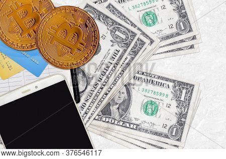 1 Us Dollar Bills And Golden Bitcoins With Smartphone And Credit Cards. Cryptocurrency Investment Co