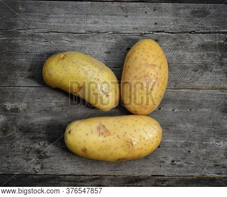 Top View Of Patato Isolated On Wooden Taber Background