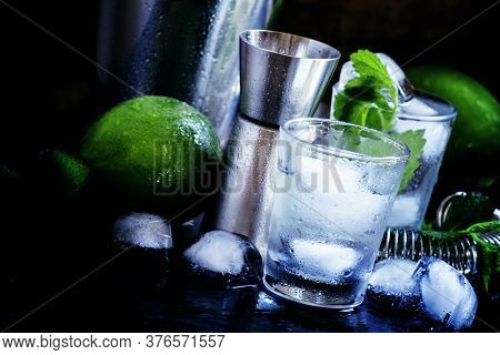 Set Of Bar Tools And Ingredients For Making Cocktails, Dark Background, Selective Focus