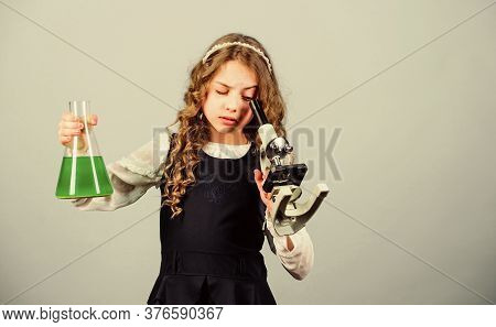 It Is Unbelievable. Small Girl Scientist With Testing Flask. Knowledge. Child Study Bilogy Lesson. D