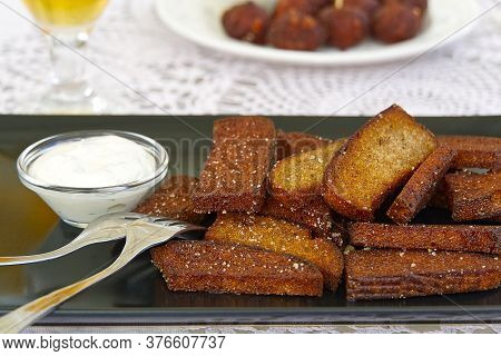 Garlic And Black Bread Snacks With Sour Cream And Greens Sauce. Perfect Snacks With Beer.
