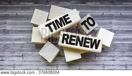 Time To Renew Text On Cubes On Wooden Background