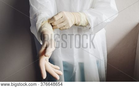 Cropped Shot Of Healthcare Worker Wearing Ppe Suit For Working In Hospital During Covid-19 Pandemic.