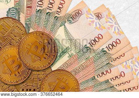 1000 Guyanese Dollars Bills And Golden Bitcoins. Cryptocurrency Investment Concept. Crypto Mining Or